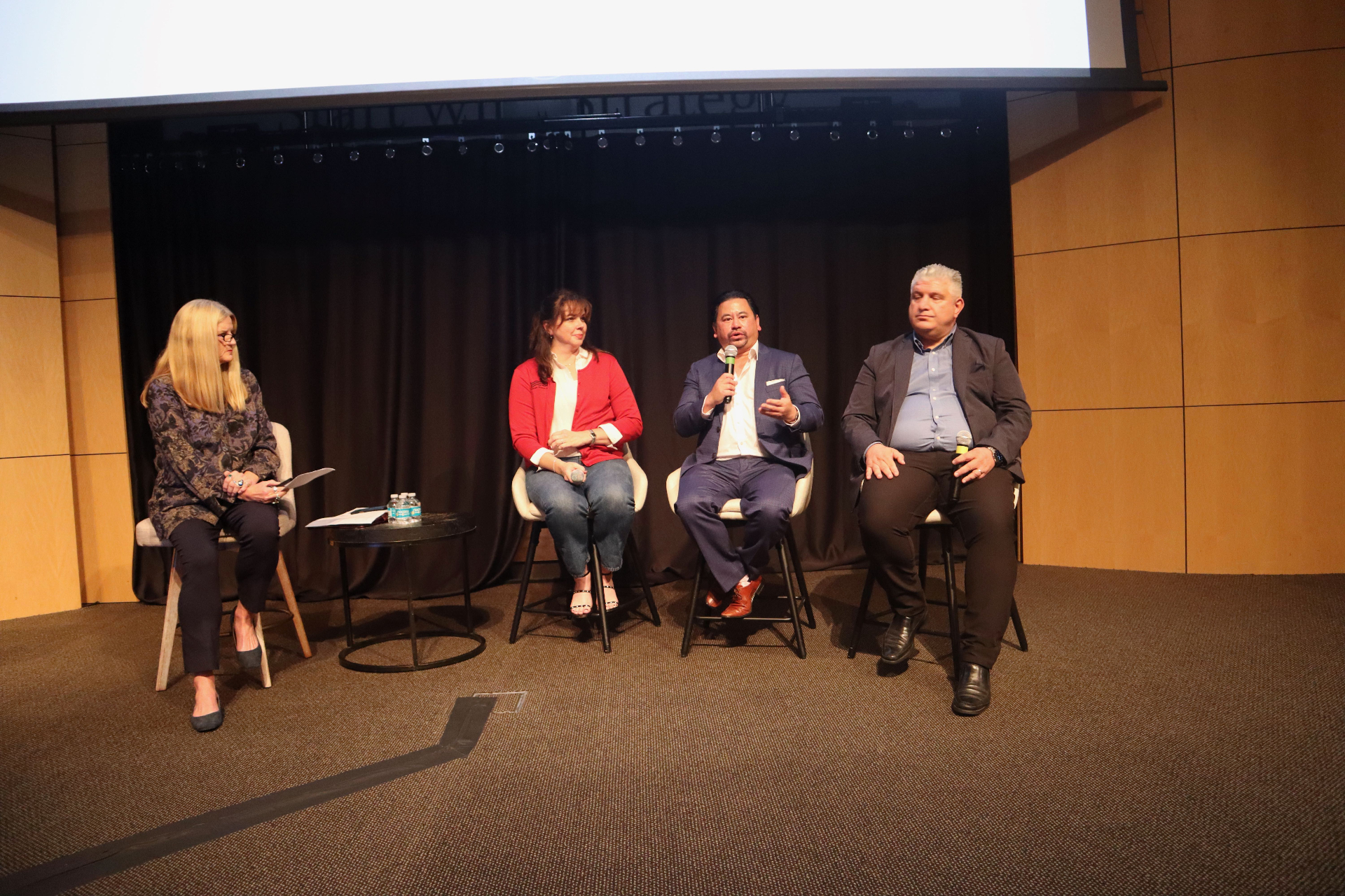 John Tan on the Napa Valley Vintners AI Symposium panel — live mid-session shot.