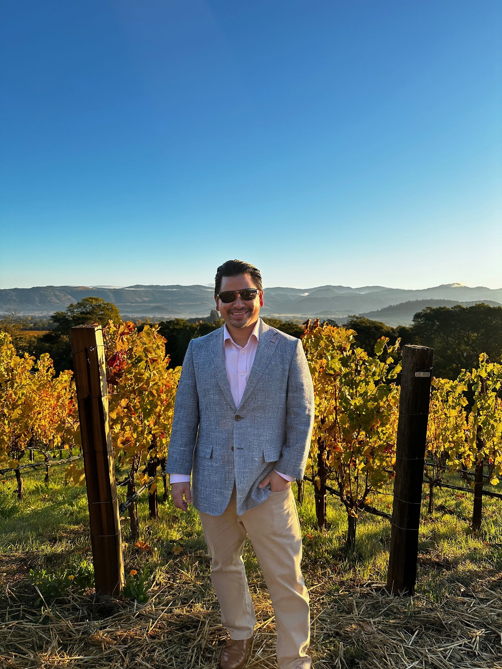 John Tan in a Napa vineyard at golden hour